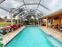 Large, screened pool with plenty of space for lounging and entertaining at 26191 Copiapo Cir, Punta Gorda, FL 33983