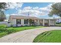 Updated single story home with carport and landscaped lawn at 1219 Ansin St, Punta Gorda, FL 33950