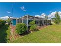 Screened pool area with patio furniture, providing a relaxing outdoor space at 125 Severin Se Rd, Port Charlotte, FL 33952
