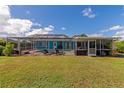 Large screened in pool and patio area, perfect for outdoor entertaining at 125 Severin Se Rd, Port Charlotte, FL 33952