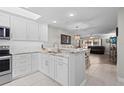 Modern kitchen boasting granite countertops and stainless steel appliances at 1415 San Cristobal Ave # A4, Punta Gorda, FL 33983