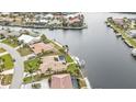 Aerial view of waterfront property, highlighting canal access and a large backyard at 1435 Sea Fan Dr, Punta Gorda, FL 33950