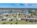 Bird's-eye view of a residential area near a lake at 1717 Nuremberg Blvd, Punta Gorda, FL 33983