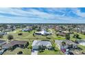 Community overview with various houses and a lake at 1717 Nuremberg Blvd, Punta Gorda, FL 33983