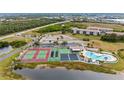 Community features tennis courts, pool, and lush landscaping at 175 Kings Hwy # 528, Punta Gorda, FL 33983
