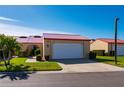 Tan house with red tile roof and white garage door at 1780 Deborah Dr # 15, Punta Gorda, FL 33950