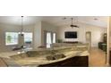 Spacious kitchen with granite countertops and stainless steel appliances at 18204 Ackerman Ave, Port Charlotte, FL 33948