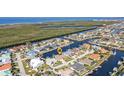 An aerial view showcasing the home's waterfront location and neighborhood at 3411 Curacao Ct, Punta Gorda, FL 33950
