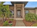 Inviting entryway with a glass front door and tiled floor at 3411 Curacao Ct, Punta Gorda, FL 33950