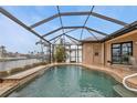 Relaxing screened-in pool with canal views at 3411 Curacao Ct, Punta Gorda, FL 33950