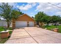 Spacious home with a large driveway and attached two-car garage at 4267 Adelaide Ave, North Port, FL 34288