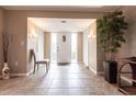 Bright and airy entryway with tile floors and a view to the living room at 1 Colony Point Dr # A19, Punta Gorda, FL 33950