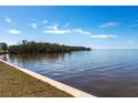 Stunning waterfront view of calm water with homes along the shoreline at 1 Colony Point Dr # A19, Punta Gorda, FL 33950