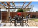 Patio furniture under a wooden pergola at 1029 Belmar Ave, Port Charlotte, FL 33948