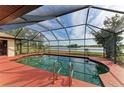 Relaxing screened pool area overlooking a tranquil lake at 1115 Venture Ct, Punta Gorda, FL 33983