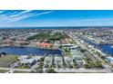 Wide aerial showcasing the community's location near the water at 1431 Aqui Esta Dr # 221, Punta Gorda, FL 33950