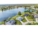 Waterfront property with canal access, surrounded by other homes at 22259 Priscilla Ave, Port Charlotte, FL 33954