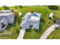 Property with a pool and large backyard, located near a canal at 22259 Priscilla Ave, Port Charlotte, FL 33954