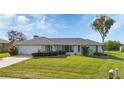 Single-story house with a spacious lawn and driveway at 22259 Priscilla Ave, Port Charlotte, FL 33954