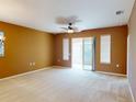 Spacious living room with sliding doors to screened lanai at 24067 Park Place S Dr # 71, Port Charlotte, FL 33980