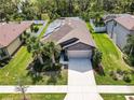 One story house with solar panels and a two-car garage at 2529 Sherman Oak Dr, North Port, FL 34289