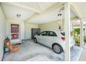 Covered carport with space for one car and extra storage at 27251 Adams St # 212, Punta Gorda, FL 33983