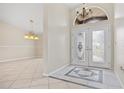 Bright entryway with double doors and decorative tile flooring at 287 Fortaleza St, Punta Gorda, FL 33983