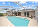 Relaxing pool area with covered lanai and patio furniture at 287 Fortaleza St, Punta Gorda, FL 33983