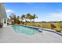 Inviting swimming pool with a tranquil view at 303 San Cristobal Ave, Punta Gorda, FL 33983