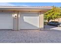 Attached garage with white door and brick pavers at 3329 Purple Martin Dr # 121, Punta Gorda, FL 33950