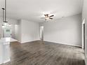 Spacious living room with tile flooring and ceiling fan at 3733 Basket St, North Port, FL 34288