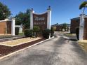 Entrance to Maria Manor condos with landscaping at 4158 Tamiami Trl # B3, Port Charlotte, FL 33952