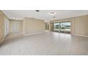 Spacious living room with tile floors and view of pool at 500 Belvedere Ct, Punta Gorda, FL 33950