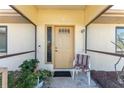 Inviting front porch featuring stylish tile flooring and a decorative front door with sidelight at 5991 Gillot Blvd, Port Charlotte, FL 33981