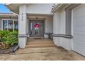 Front entrance with a welcoming porch and steps leading to the front door at 820 Bal Harbor Blvd, Punta Gorda, FL 33950