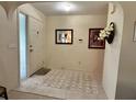 Bright entryway with tiled floors, a door, and a small rug at 1022 Campbell St, Port Charlotte, FL 33953