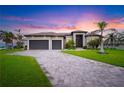 Stunning curb appeal at sunset at 1099 Cimarron Dr, Punta Gorda, FL 33950