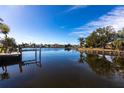 Scenic view of a calm canal with neighboring houses at 164 Baldwin Se Ct, Port Charlotte, FL 33952