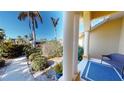 Front porch with seating area and view of landscaped walkway at 220 Shreve St, Punta Gorda, FL 33950