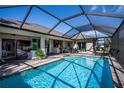 Inviting screened-in pool area with ample seating at 269 Mariner Ln, Rotonda West, FL 33947