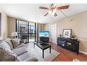 Spacious living room with balcony access and ample natural light at 3006 Caring Way # 331, Port Charlotte, FL 33952