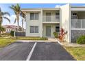 Condo building exterior showcasing a two-story unit with parking at 3600 Bal Harbor Blvd # 1A, Punta Gorda, FL 33950