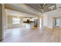 Modern kitchen with white cabinets, granite counters, and stainless steel appliances at 4393 Antioch St, North Port, FL 34288