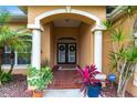 Front entrance with a double door and terracotta tile flooring at 4398 Appleton Ter, North Port, FL 34286