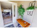 Open door reveals a view into the living room with hardwood floors and a sitting area at 1022 Lucia Dr, Punta Gorda, FL 33950