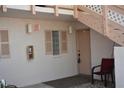 Condo entrance with a door, a chair, and a fire extinguisher at 1051 Forrest Nelson Blvd # A-104, Port Charlotte, FL 33952