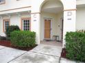 Front entrance with two doors and landscaping at 1246 Rio De Janeiro Ave # 503, Punta Gorda, FL 33983