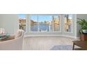 Bright dining room with water views and modern light fixture at 1460 Raven Ct, Punta Gorda, FL 33950