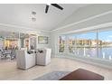Bright dining room with water views and modern light fixture at 1460 Raven Ct, Punta Gorda, FL 33950