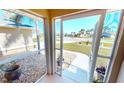 Relaxing screened porch with view of neighborhood at 16129 Coruna Ct, Punta Gorda, FL 33955
